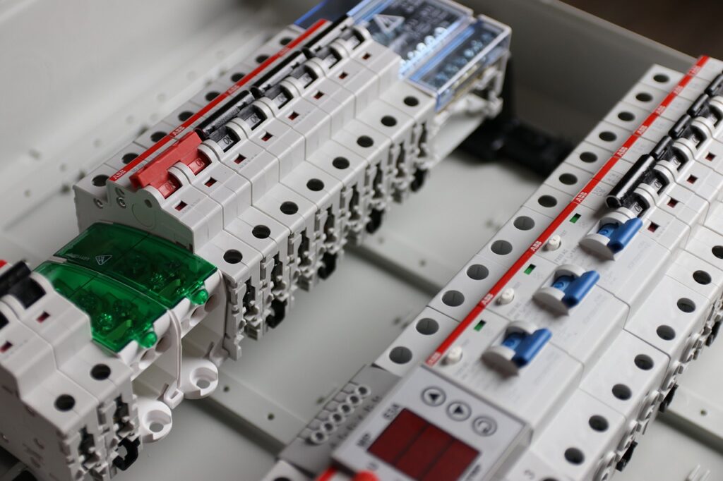 Close-up of a circuit breaker with electrical wires connected, ensuring safety and preventing electrical overload