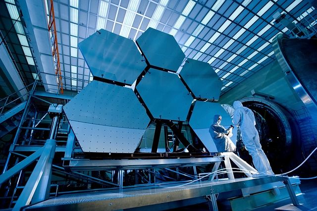 he James Webb Telescope floating in space, capturing stunning images of the universe.